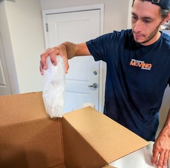 WellKnown movers securing furniture inside the truck